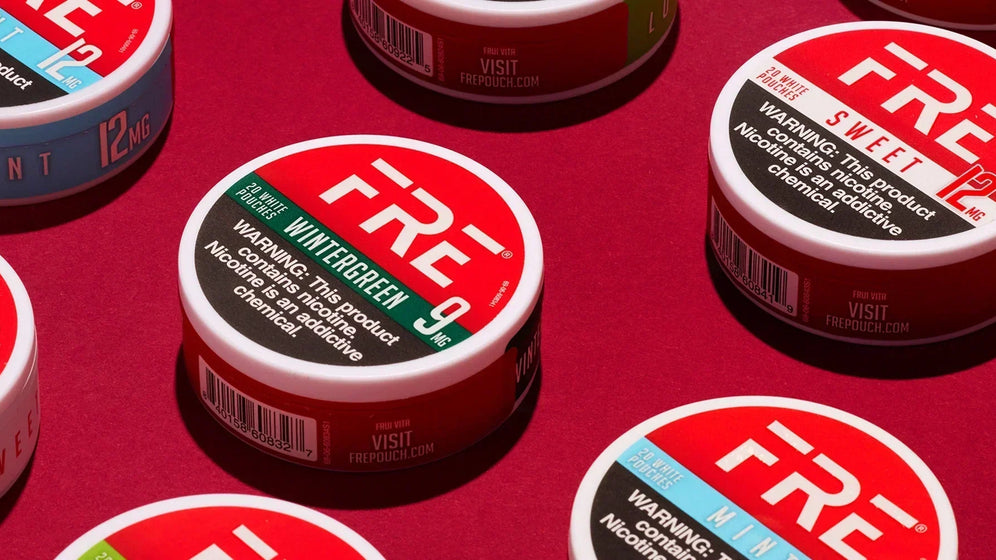 FRE nicotine pouches in mint, wintergreen, sweet, and lush flavors on red background