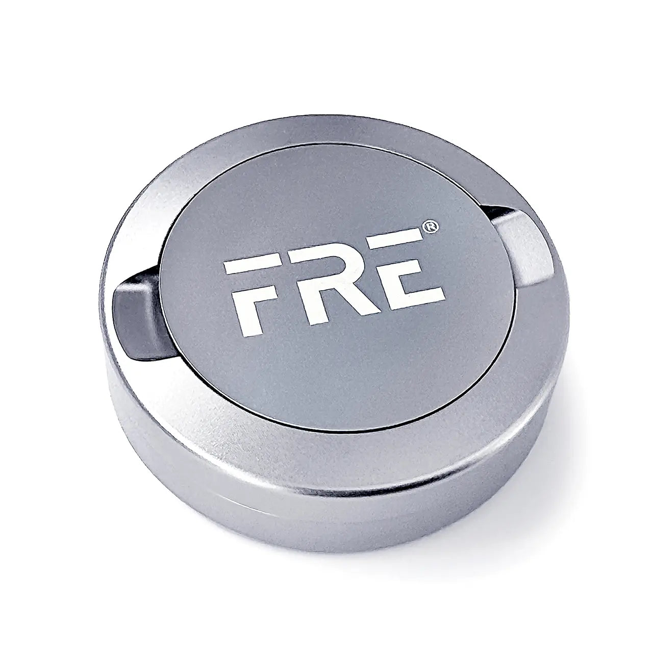 Silver FRE nicotine pouch can with sleek, modern design, ideal for storing FRE pouches in style; shown closed with bold FRE logo – premium container for smokeless nicotine pouches.