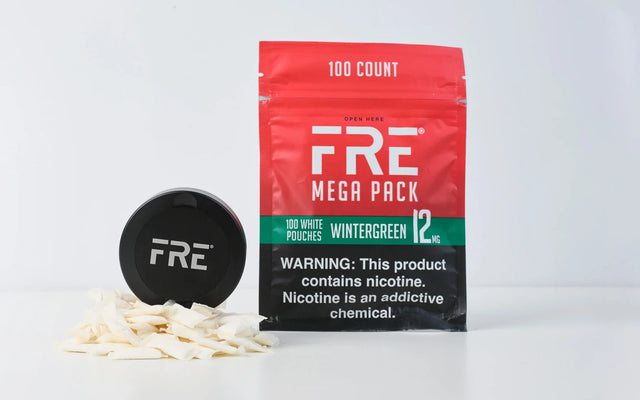 FRE Black Prmium travel tin and 12mg Wintergreen Mega Pack