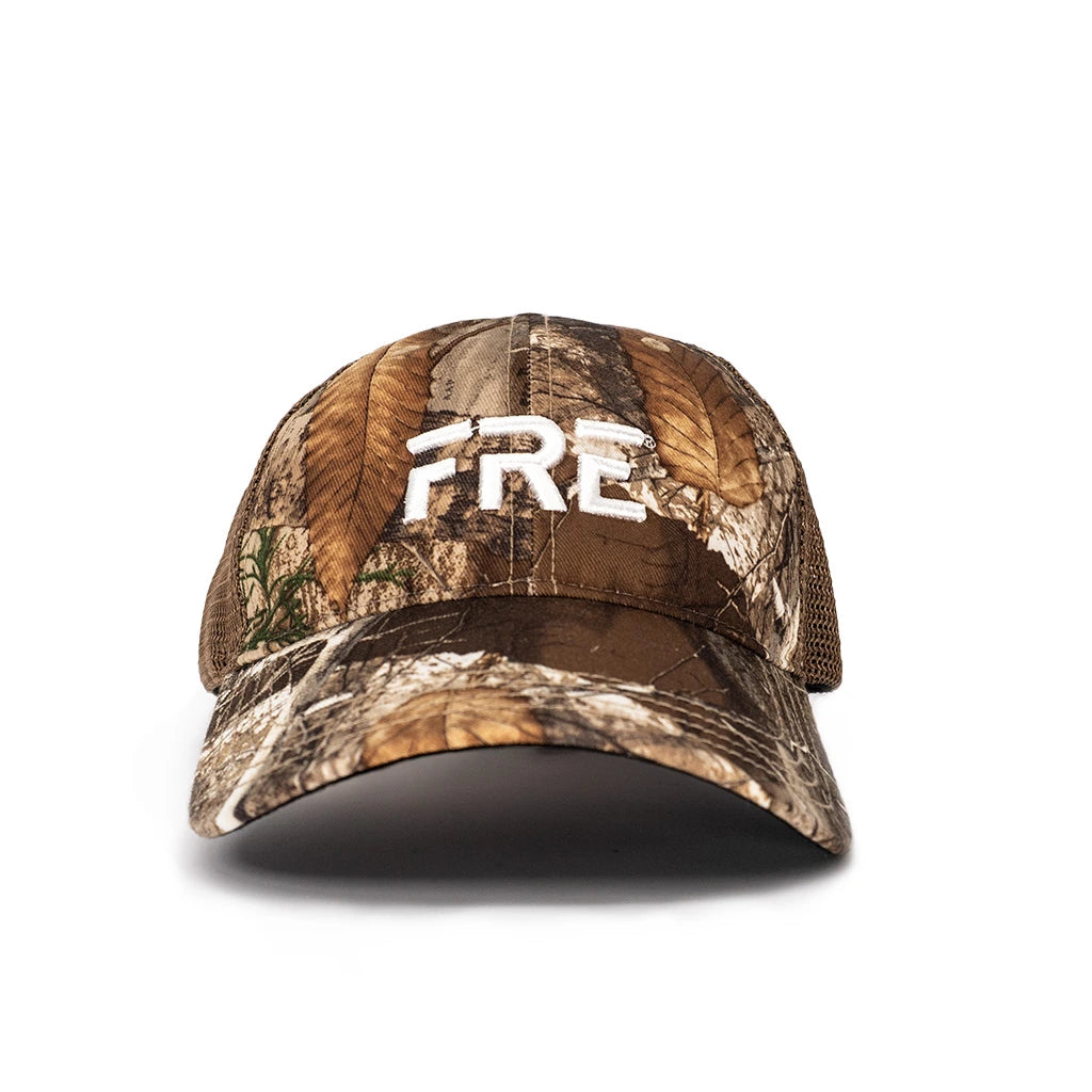 Camo trucker hat with curved brim and white FRE logo embroidered on the front panel.